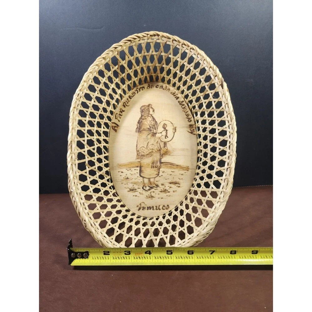 Chilean wicker basket featuring a wood-burned scene of a Mapuche woman from...